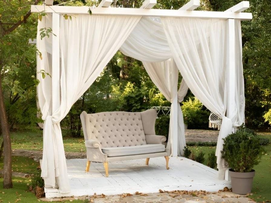 White sheer wave curtains pergola